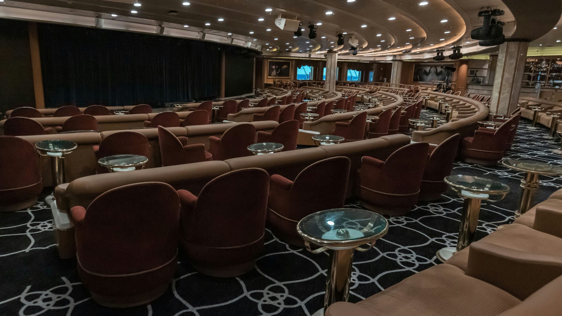 a large room with rows of chairs and tables